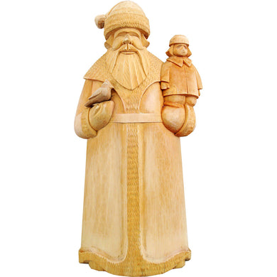 A wooden carving of Santa Claus holding a small bird, likely a robin, in his hand.