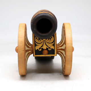 a small wooden toy car with a black top