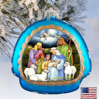 A blue ornament with a nativity scene depicting the birth of Jesus Christ, surrounded by animals such as sheep and goats.