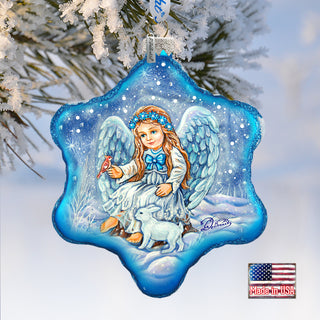 a glass ornament hanging from a christmas tree