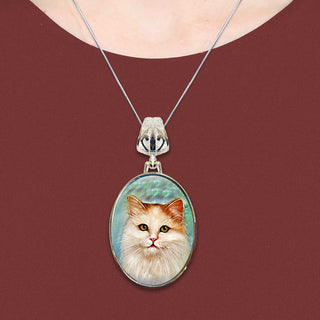 A necklace with a pendant featuring a close-up portrait of a cat.