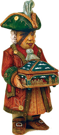 A wooden sculpture of a man wearing a green hat and holding a box with a cityscape design on it.