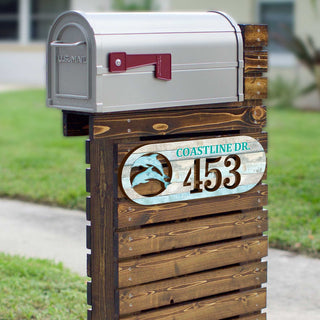 Oval coastal address plaque featuring dolphin cutout, house number 453, and customizable COASTLINE DR. street name, handcrafted by GDebrekht Artistic Studio. Perfect for nautical house numbers, coastal door decoration, beach house decor, and outdoor holiday decorations.