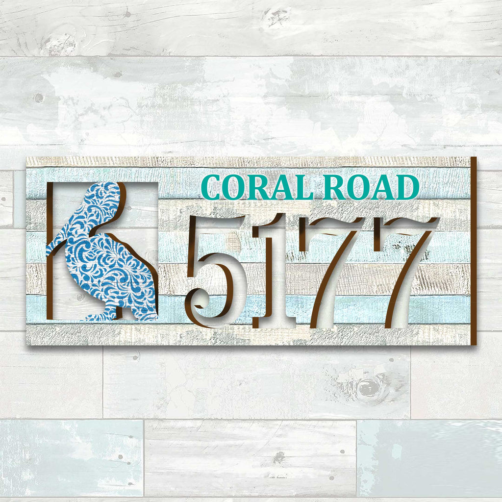 Coastal address plaque with blue pelican cutout, house number 5177, and customizable CORAL ROAD street name, handcrafted by GDebrekht Artistic Studio. Perfect for nautical house numbers, coastal door decoration, beach house decor, and outdoor holiday decorations.