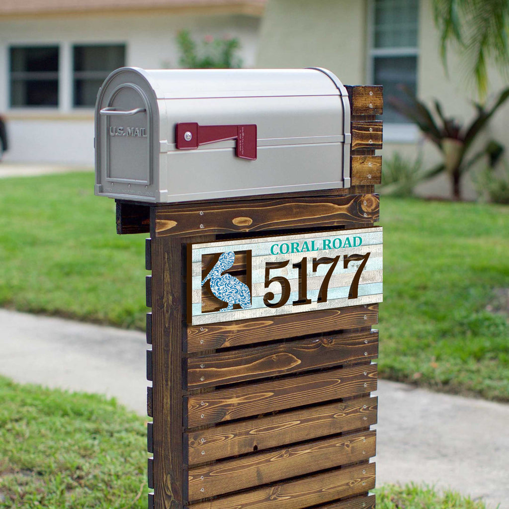 Coastal address plaque with blue pelican cutout, house number 5177, and customizable CORAL ROAD street name, handcrafted by GDebrekht Artistic Studio. Perfect for nautical house numbers, coastal door decoration, beach house decor, and outdoor holiday decorations.