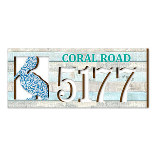 Coastal address plaque with blue pelican cutout, house number 5177, and customizable CORAL ROAD street name, handcrafted by GDebrekht Artistic Studio. Perfect for nautical house numbers, coastal door decoration, beach house decor, and outdoor holiday decorations.