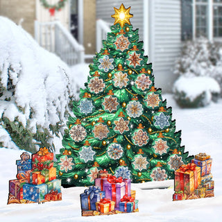 A large, colorful Christmas tree decorated with ornaments and lights stands in a snowy landscape, surrounded by gift boxes and wreaths.