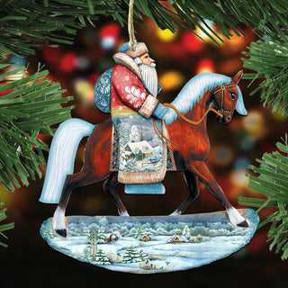 A Christmas ornament depicting Santa Claus riding a horse, with a snowy landscape in the background.