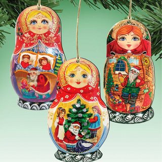 three colorful Christmas ornaments hanging from a tree branch.