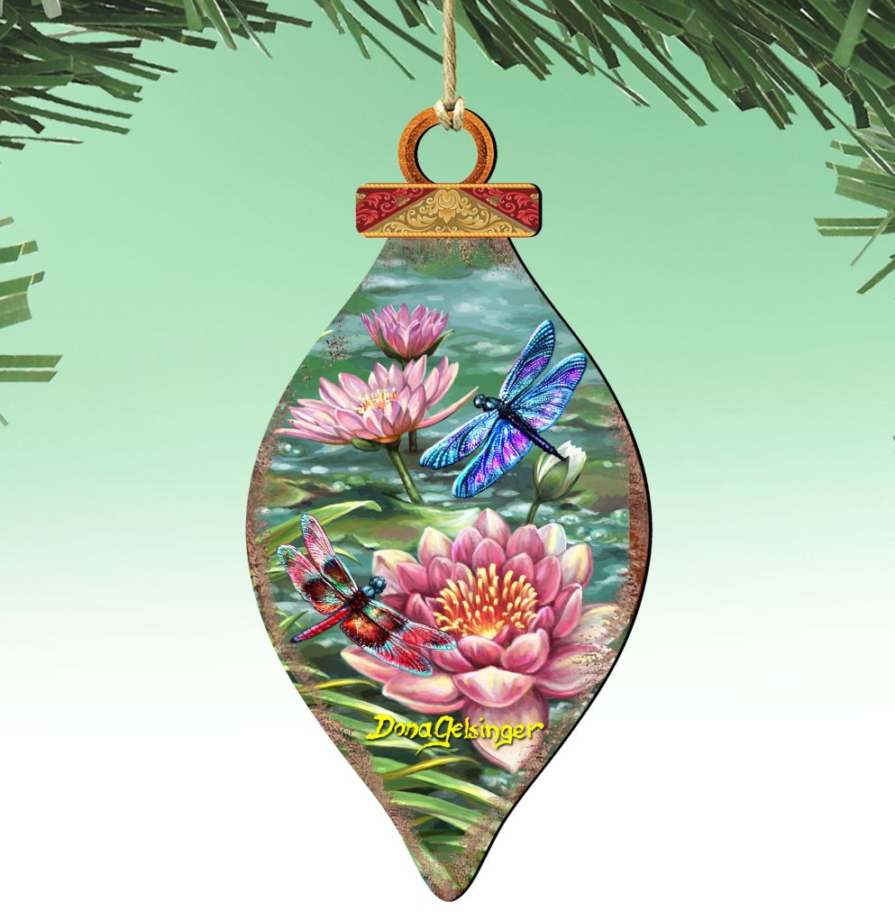 A decorative ornament featuring a dragonfly and pink water lilies against a green background.