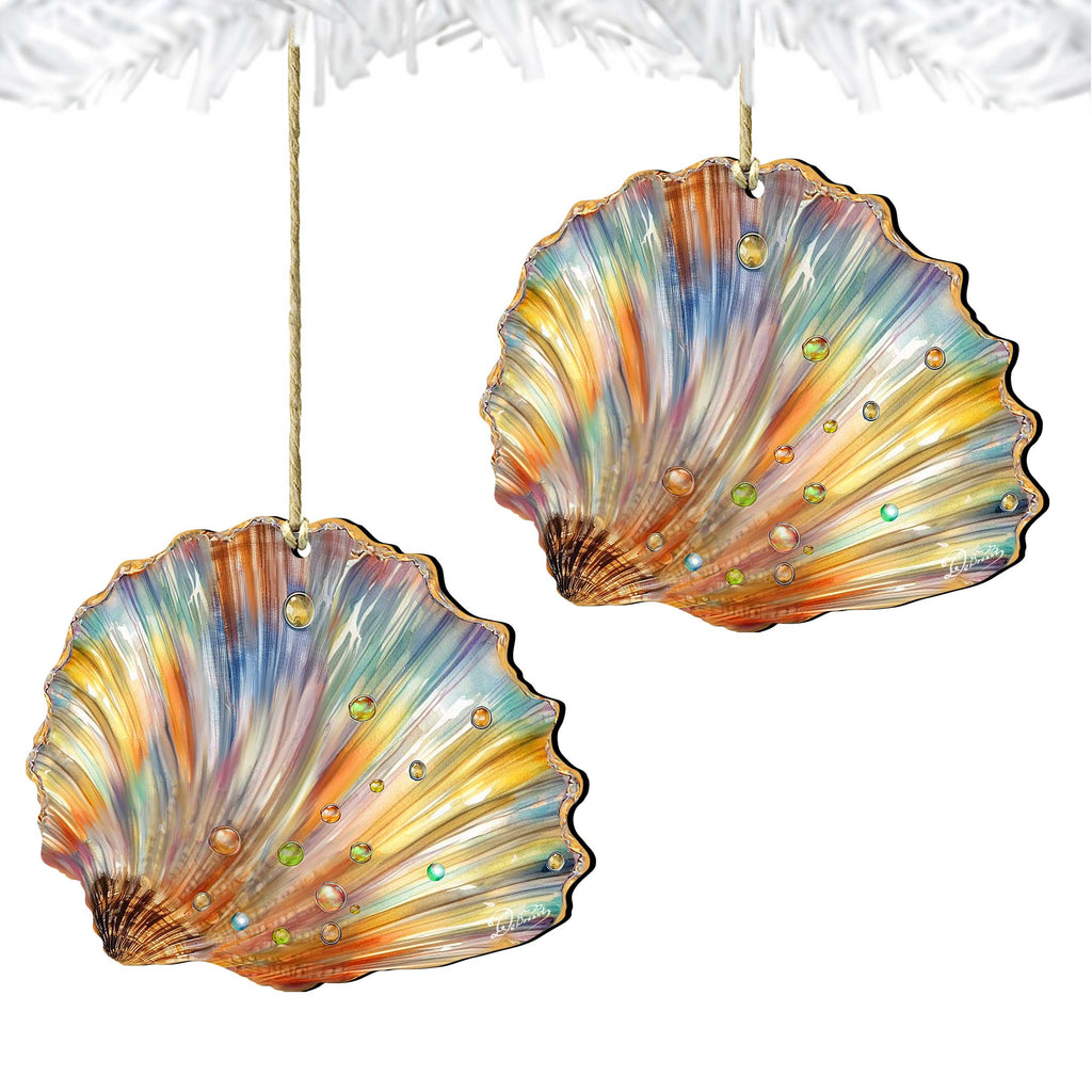 two colorful, decorative shell ornaments hanging from strings.