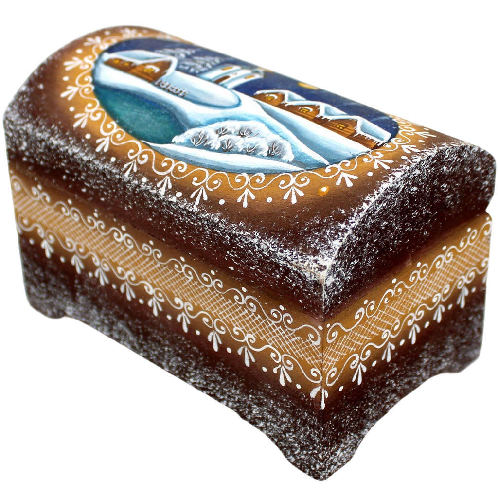 A decorative wooden box with a winter landscape painted on it, featuring a snowy scene with houses and trees.