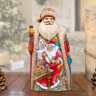 A detailed figurine of Santa Claus, with intricate carvings and decorations, is displayed on a wooden surface.