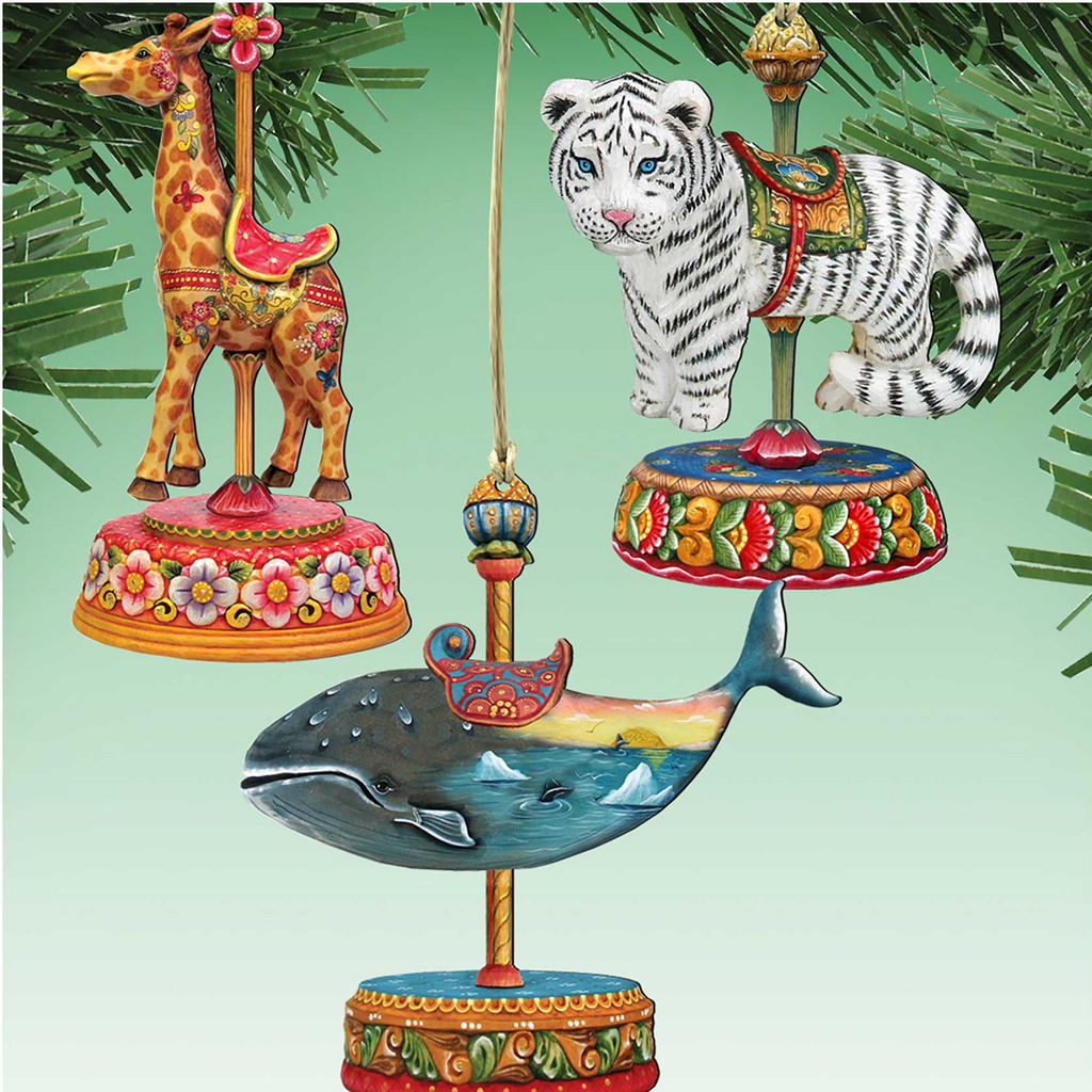 a collection of colorful and whimsical ornaments, including a giraffe, a tiger, a whale, and a carousel horse, all suspended from a string.