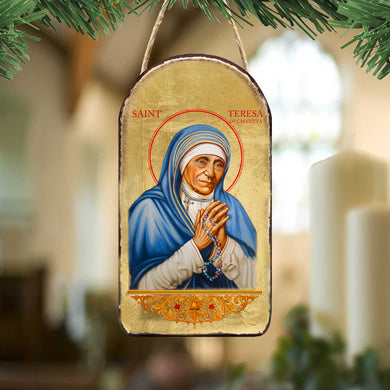 a religious icon of Saint Teresa of Calcutta, a prominent Catholic saint known for her dedication to serving the poor and sick.