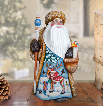 A colorful figurine of Santa Claus holding a reindeer and a bird, set against a snowy background.