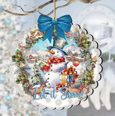 A snowman ornament with a blue bow, surrounded by a wreath of snowflakes and pine branches, with a snowy village scene in the background.