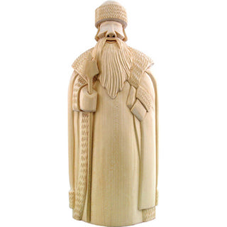A wooden sculpture depicting a bearded man wearing a hat and holding a staff.