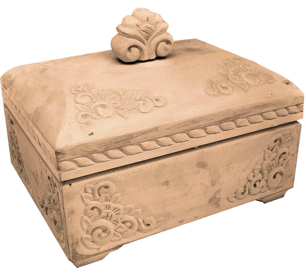 a wooden box with intricate carvings and a decorative top.