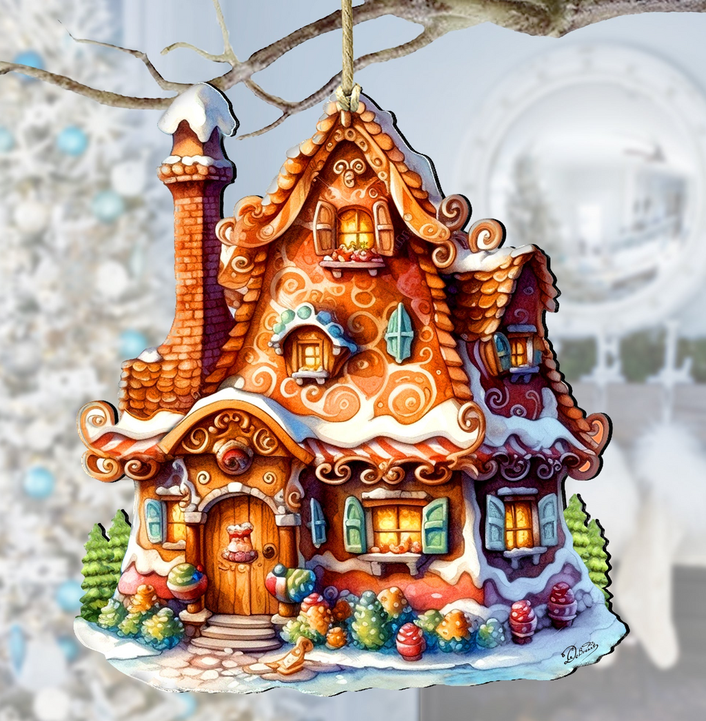 A whimsical, hand-painted gingerbread house ornament with intricate details and decorations, hanging from a branch against a snowy background.