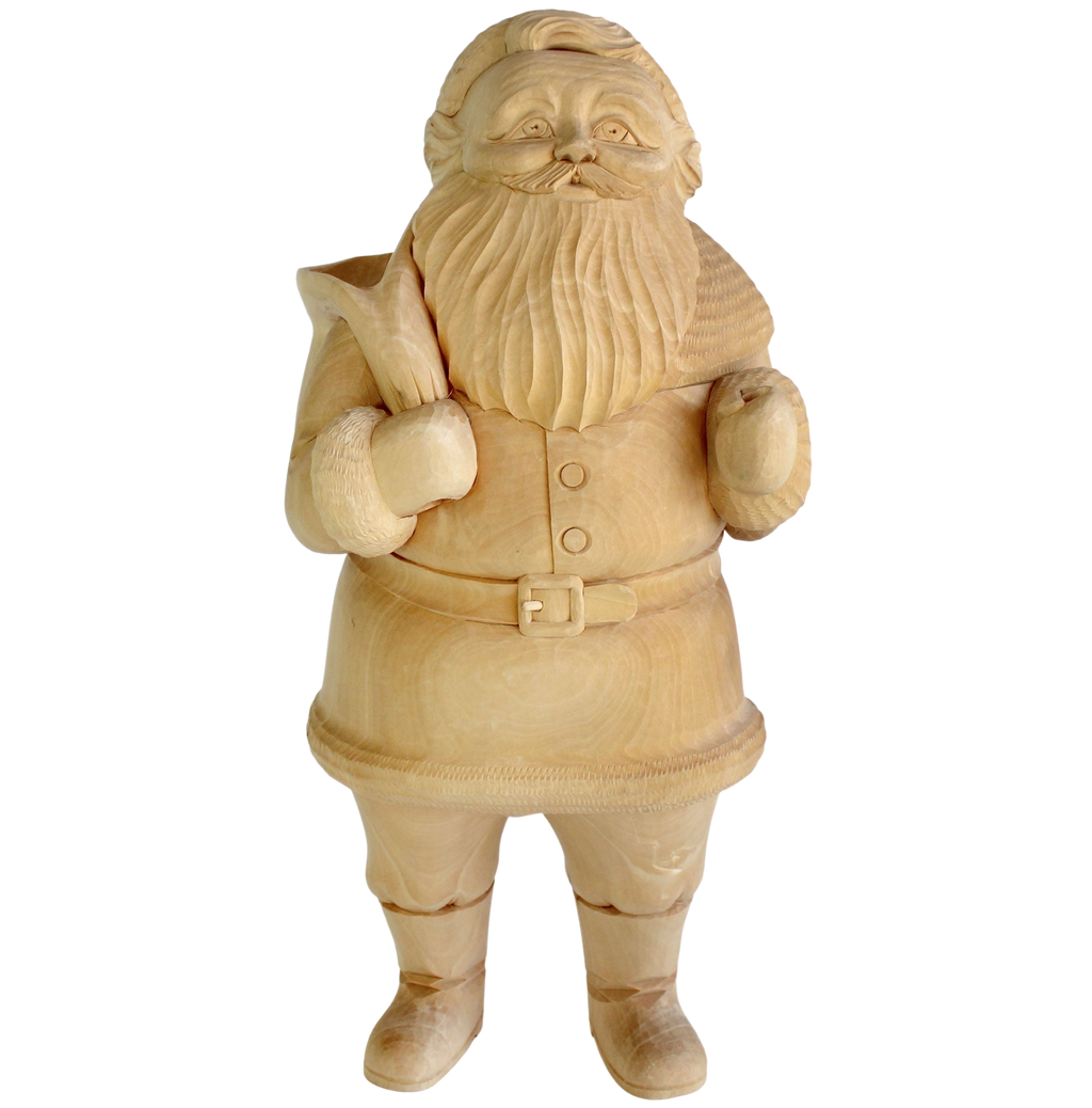 A wooden sculpture of a smiling, bearded figure holding a cane and wearing a hat.
