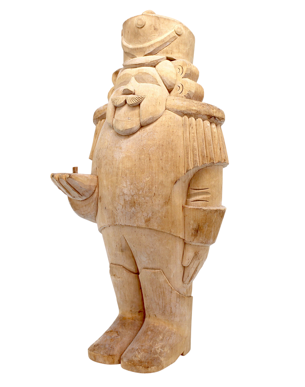 A wooden sculpture of a nutcracker figure, with intricate details and a detailed design.