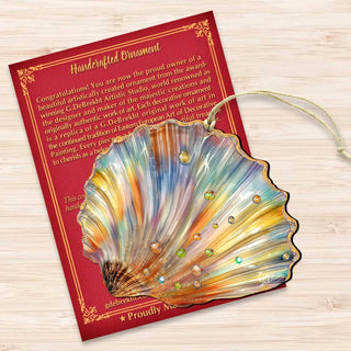 a handcrafted ornament in the shape of a seashell, with a vibrant and colorful design.
