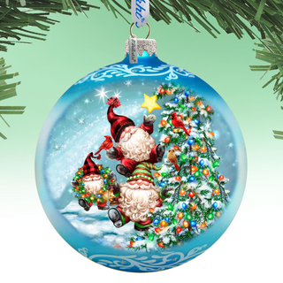 A blue Christmas ornament with a snowy landscape and Santa Claus holding a star, surrounded by other Christmas decorations.