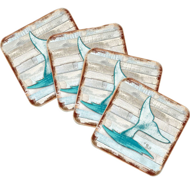 four square coasters with a blue and white design featuring a shark fin.