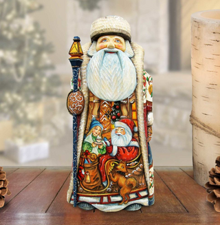 A colorful and detailed figurine of Santa Claus, with intricate details and vibrant colors, is displayed on a wooden surface.