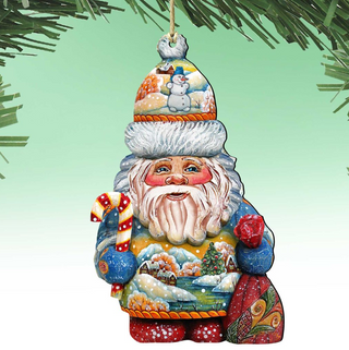 A colorful ornament depicting a smiling Santa Claus figure holding a candy cane and a sack, with a snowy landscape and a snowman in the background.