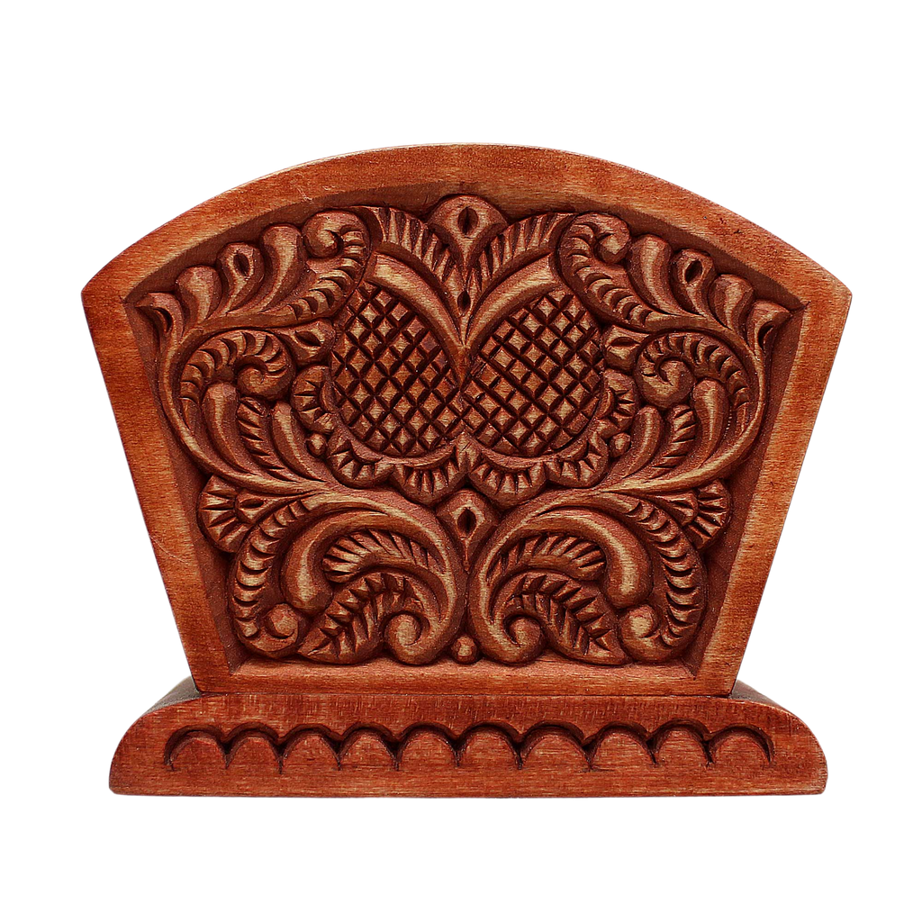 a wooden carving with intricate floral designs and patterns.