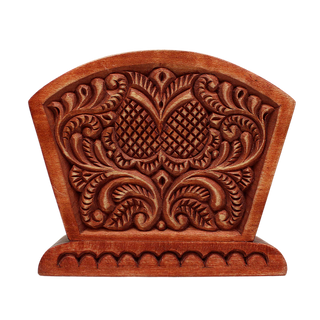 a wooden carving with intricate floral designs and patterns.