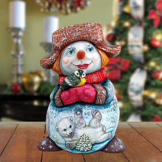 A colorful snowman figurine with a bird perched on its shoulder, set against a blurred background of Christmas decorations.
