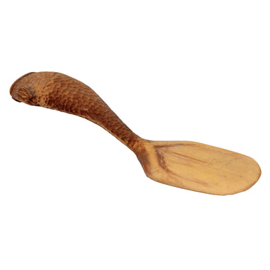 A wooden spoon with a fish-shaped handle is shown against a white background.