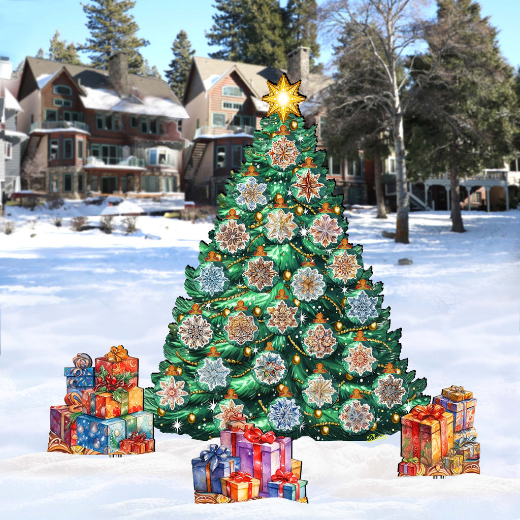 A large, colorful Christmas tree decorated with presents stands in the snow, surrounded by smaller wrapped gifts. In the background, there are houses and trees, creating a festive winter scene.