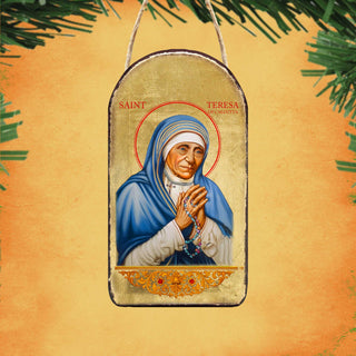 a religious icon of Saint Teresa of Calcutta, a prominent Catholic saint known for her dedication to serving the poor and sick.