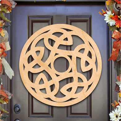a wooden door with a circular Celtic knot design hanging on it.