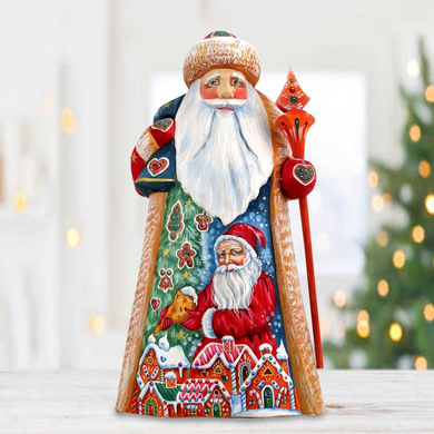 A colorful and detailed figurine of Santa Claus, with intricate details and decorations, is displayed against a blurred background of Christmas lights.