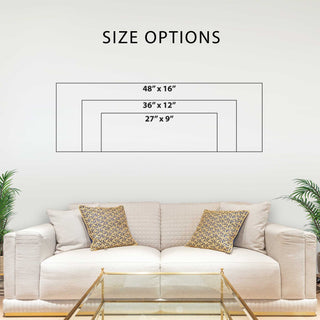 a living room with a white sofa and a glass coffee table. Above the sofa, there is a wall with a size chart indicating the dimensions of the sofa in inches.