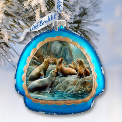 a blue ornament hanging from a tree