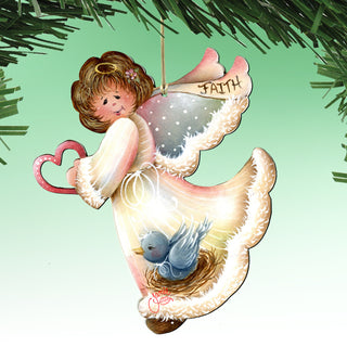 A heart-shaped ornament with a bird in a nest, hanging from a string.