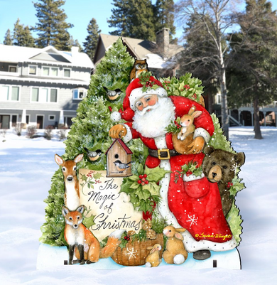 A Christmas-themed cutout of Santa Claus surrounded by various woodland animals, including a birdhouse, a deer, a bear, and a rabbit, all set against a snowy background with a house and trees in the distance.