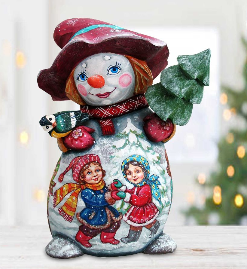 A colorful figurine of a snowman, featuring a smiling face, a hat, and a scarf, holding a small bird and a tree.