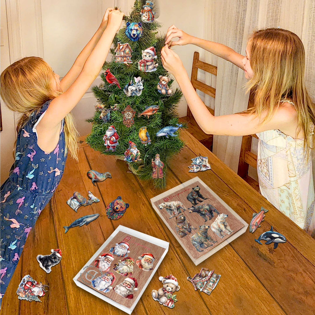 Two young girls decorating a Christmas tree with ornaments, surrounded by various animal-themed ornaments and a puzzle box.