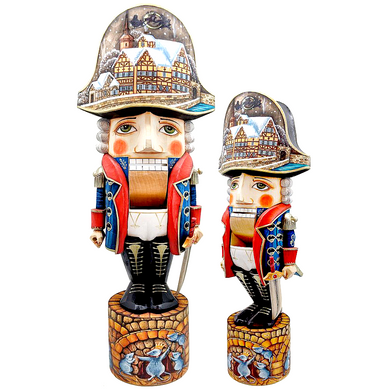 two nutcracker figurines, one larger and one smaller, both wearing colorful outfits and hats with intricate designs.