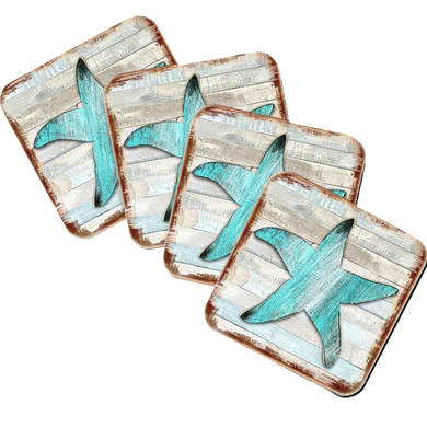 a set of four square coasters with a blue starfish design on them.