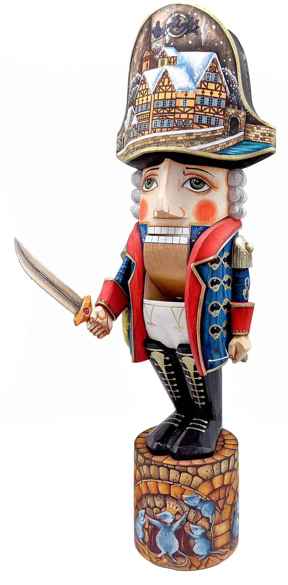 A wooden nutcracker figurine wearing a hat with a detailed scene of a town on it, holding a sword in its hand.