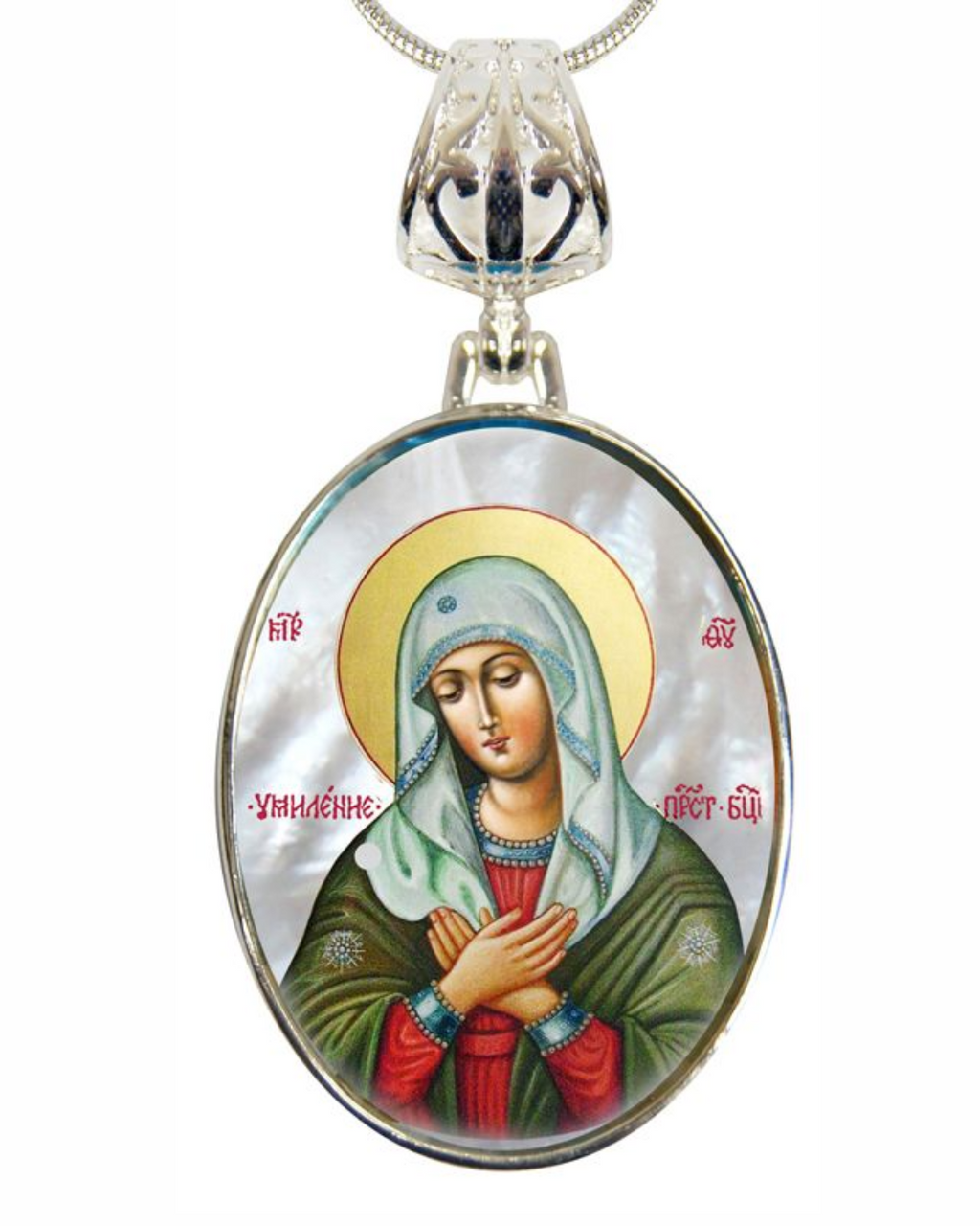 a pendant with a religious icon of a woman, possibly a depiction of the Virgin Mary, wearing a green robe and a white veil. The pendant is suspended from a chain, and the image is framed within an oval shape.