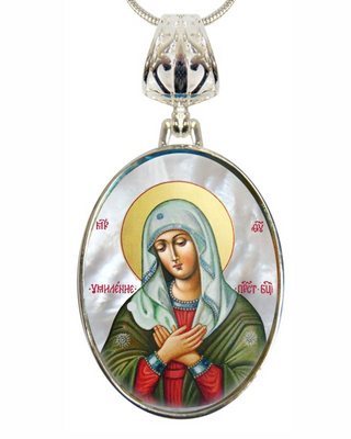 a pendant with a religious icon of a woman, possibly a depiction of the Virgin Mary, wearing a green robe and a white veil. The pendant is suspended from a chain, and the image is framed within an oval shape.